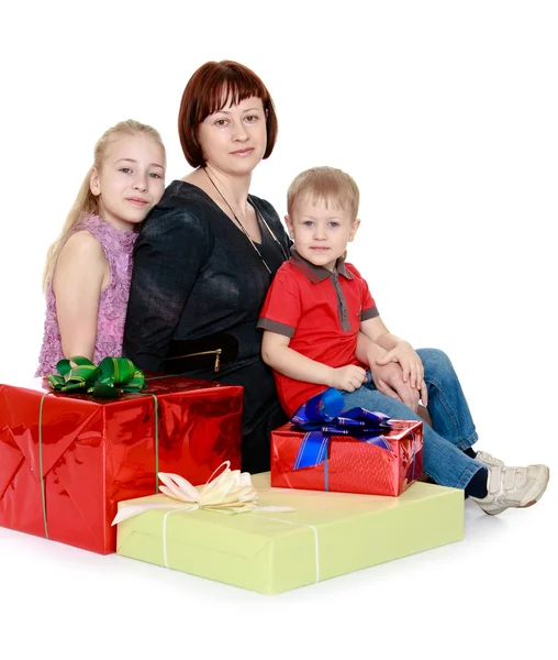 Happy family mother the eldest daughter and youngest son sitting — Stock Photo, Image