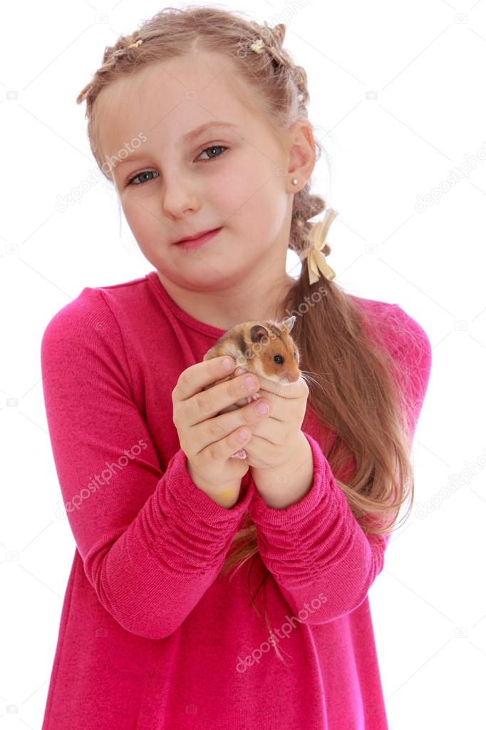 Girl school girl holding a hamster