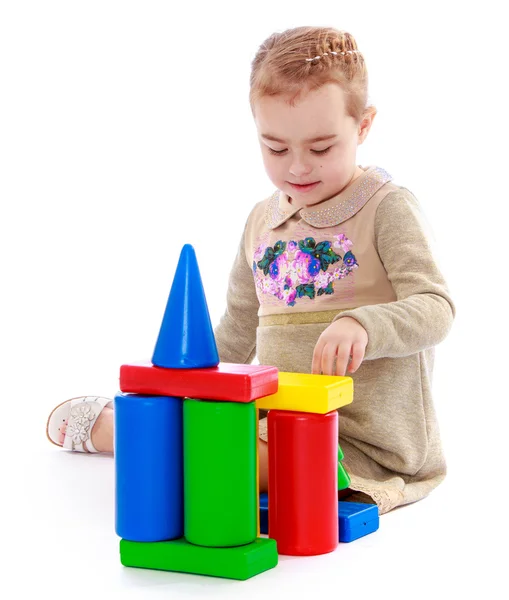 Little girl playing in the cylinders — Stock Photo, Image