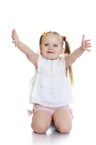 Beautiful blond little girl stands — Stock Photo, Image