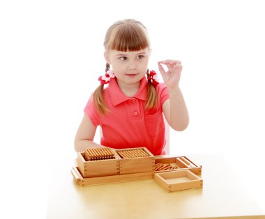 The girl in the Montessori environment clipart
