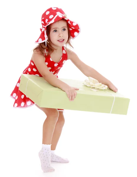 Adorabile bambina in abito rosso e cappello con pois — Foto Stock