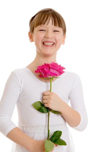 Smiling girl holds a rose, close-up — Stock Photo, Image