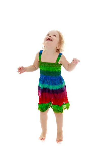 Very little cheerful girl jumping — Stock Photo, Image