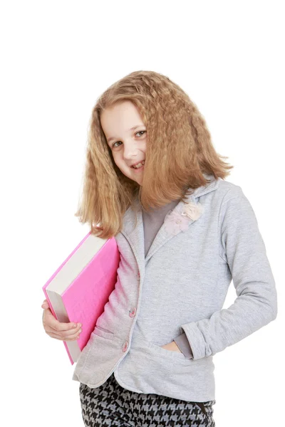 Caucasian girl schoolgirl holding a book under his arm , close-u — Stock Photo, Image
