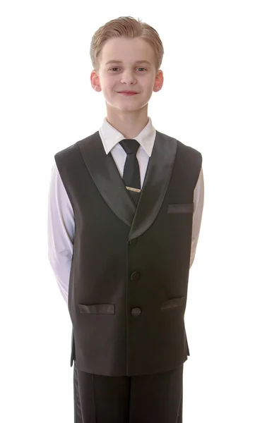 Menino adolescente elegante em um colete e gravata, close-up — Fotografia de Stock