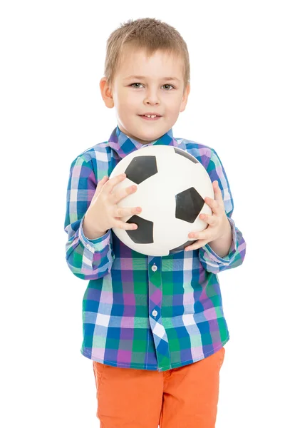 Menino segurando uma bola de futebol — Fotografia de Stock