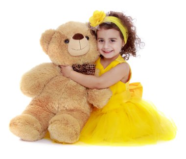 Portrait of beautiful girl 4 years which hugs a Teddy bear