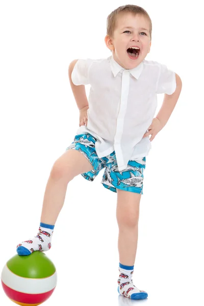 Funny little boy in shorts playing football — Stock Photo, Image