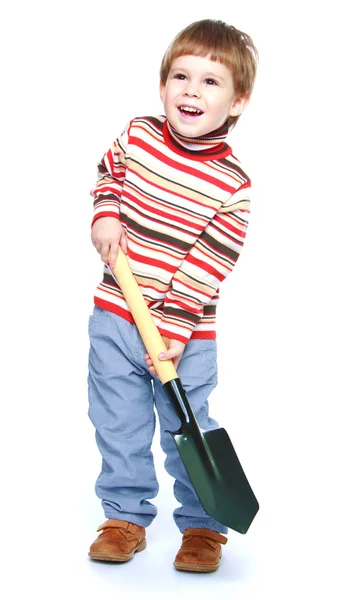 Little boy with a shovel in his hands — Stock Photo, Image