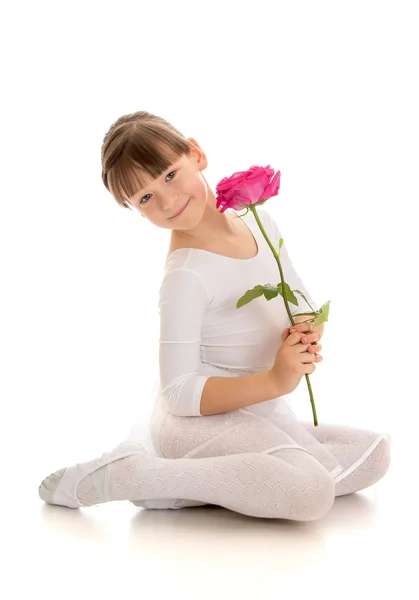 Child gymnast in white oor — Stockfoto