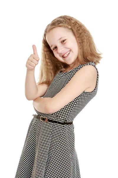 Teenage girl shows the hand gesture thumb up — Stok fotoğraf