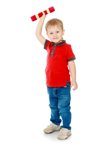The blond boy holding a dumbbell — Stock fotografie