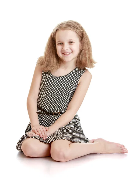 Charming teenage girl sat on the floor with bare feet — Stock Photo, Image