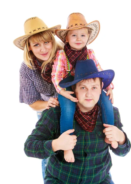 Cheerful young cowboy family in hats, mom dad and little daughte — Stock Photo, Image