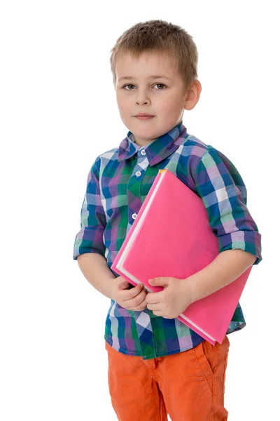 Fair-haired little boy holding under his arm a thick book, he go — Φωτογραφία Αρχείου