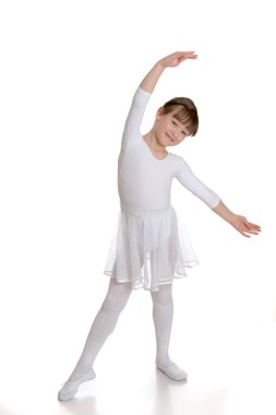 Girl gymnast in white bikini doing sport exercises