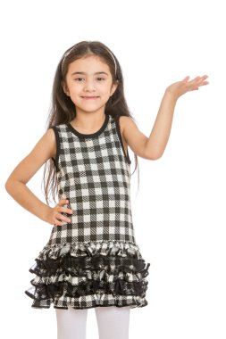 Elegant little dark-haired girl with long hair and plaid trendy 
