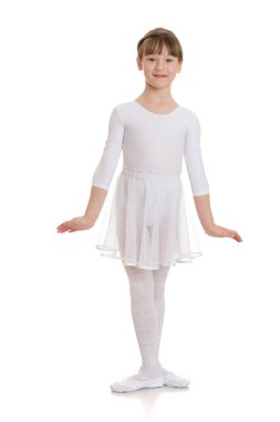 Slender beautiful girl in sports a white leotard 