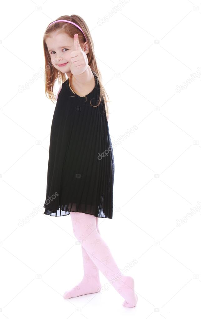 Fashionable little girl in a long black 
