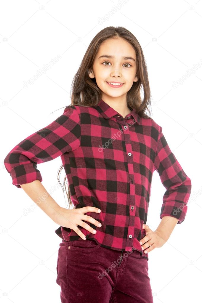 Charming long-haired girl in a plaid shirt and corduroy jeans , close-up