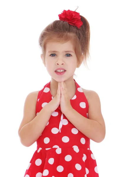 Little blonde girl in a red summer dress — Stok fotoğraf