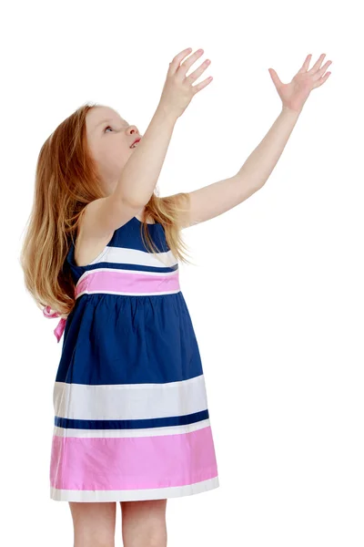 Beautiful long-haired little girl in a striped short summer dres — Stockfoto