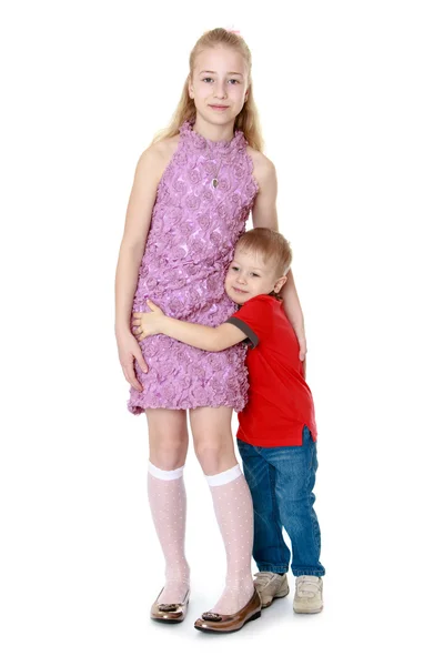Little charming boy clung to his older sister, he loves her a lot — Stock Photo, Image