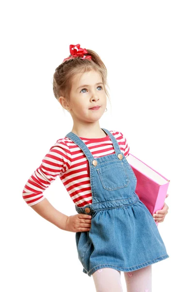 Adorable little girl in a short denim dress — Stockfoto