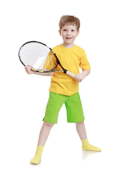 Boy with racket in hand — Stockfoto