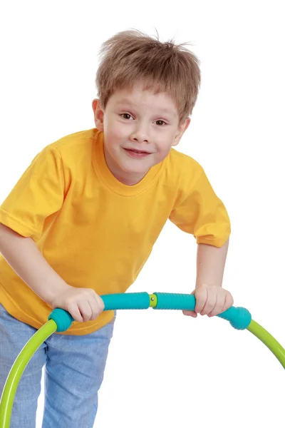 Funny boy playing with a Hoop — Stockfoto