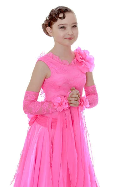 Girl dancing in a long pink dress — Stok fotoğraf