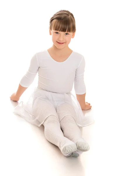 Girl sitting on the floor legs — Stockfoto