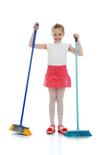 Girl sweeping the floor — Stock Photo, Image