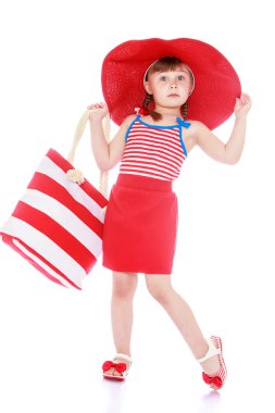 Fashionable little girl on the beach clipart