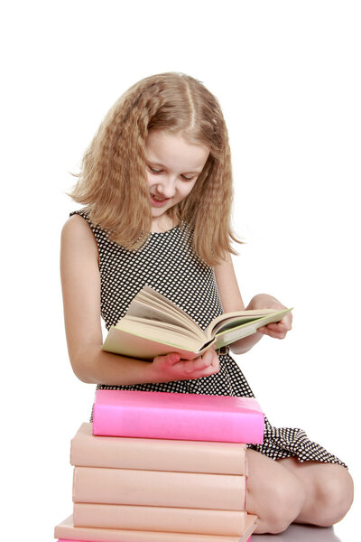 Blonde girl with a book in his hands