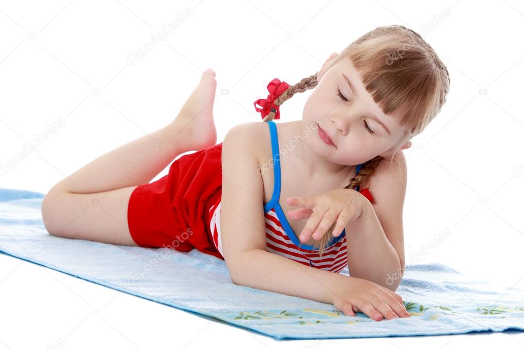 Fashionable little girl on the beach