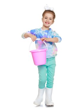 little girl with a bucket