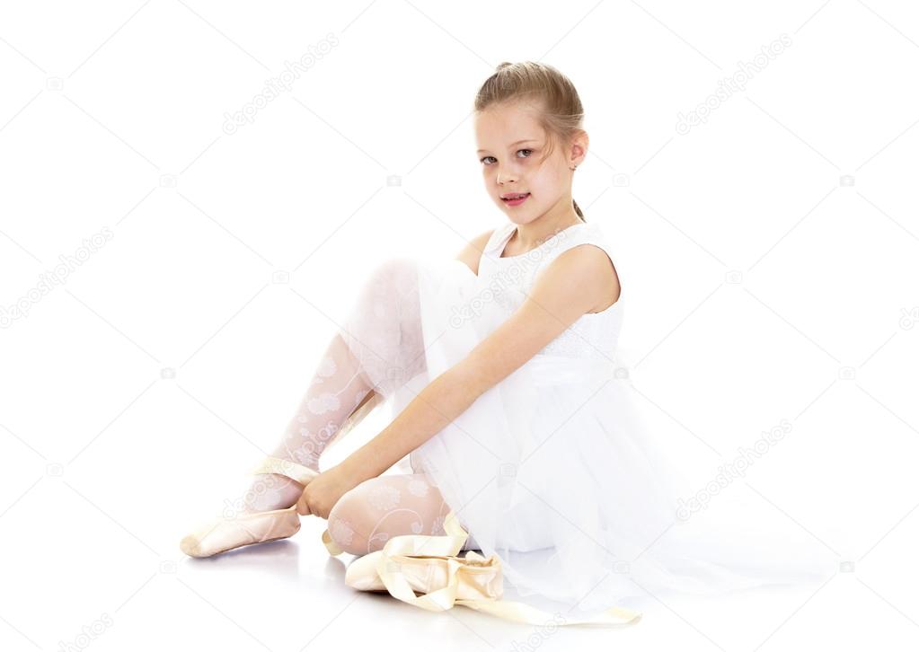 The girl wears Pointe shoes