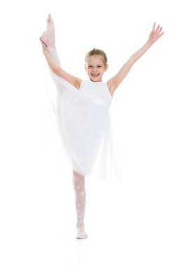 The girl athlete raised his leg