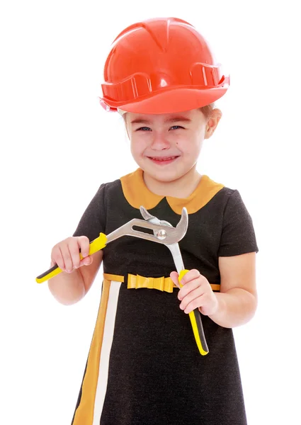 Little girl holding a pair of pliers — Stockfoto