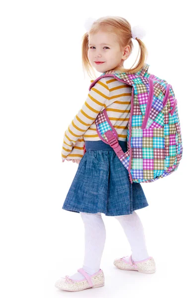 Girl sitting on books — Stock Photo, Image