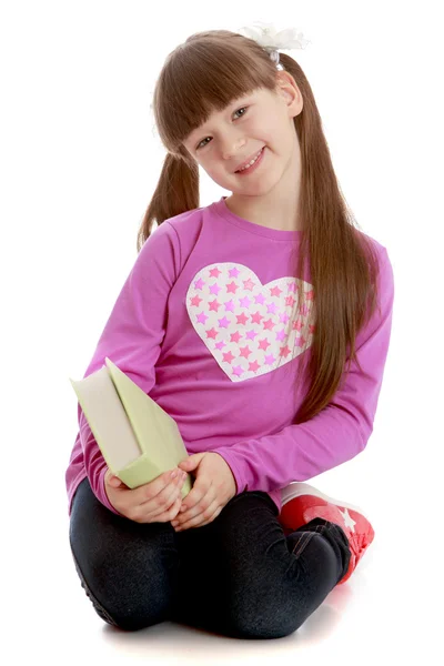 Girl with a book in his hands — Stock Photo, Image