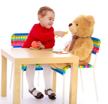 Girl feeding a bear