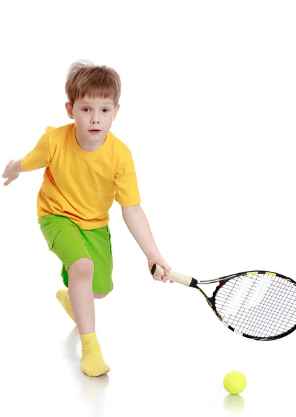 Boy playing tennis