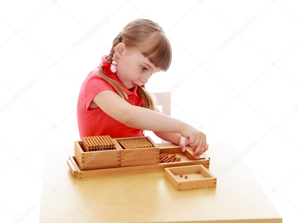 Little girl in a Montessori environment