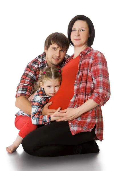 Family hugging pregnant mom — Stock Photo, Image