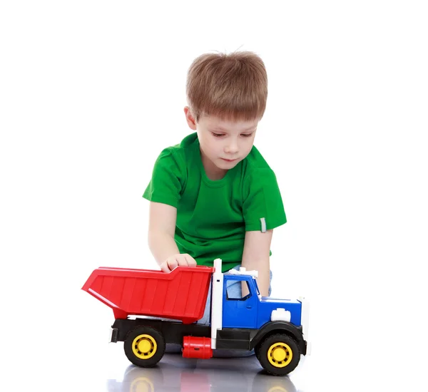 Boy playing with the machine — Stock Photo, Image