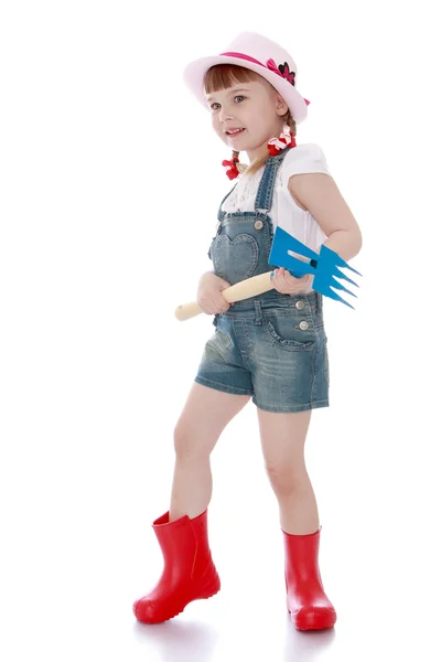 Girl with garden tools — Stock Photo, Image