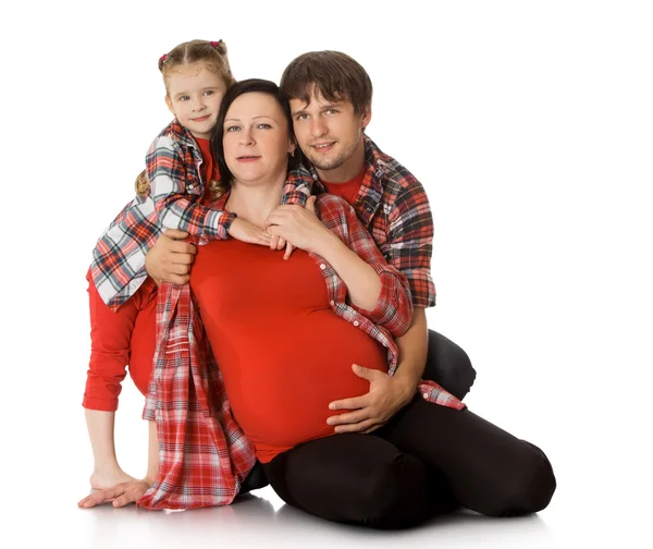 Familia abrazo embarazada mamá —  Fotos de Stock